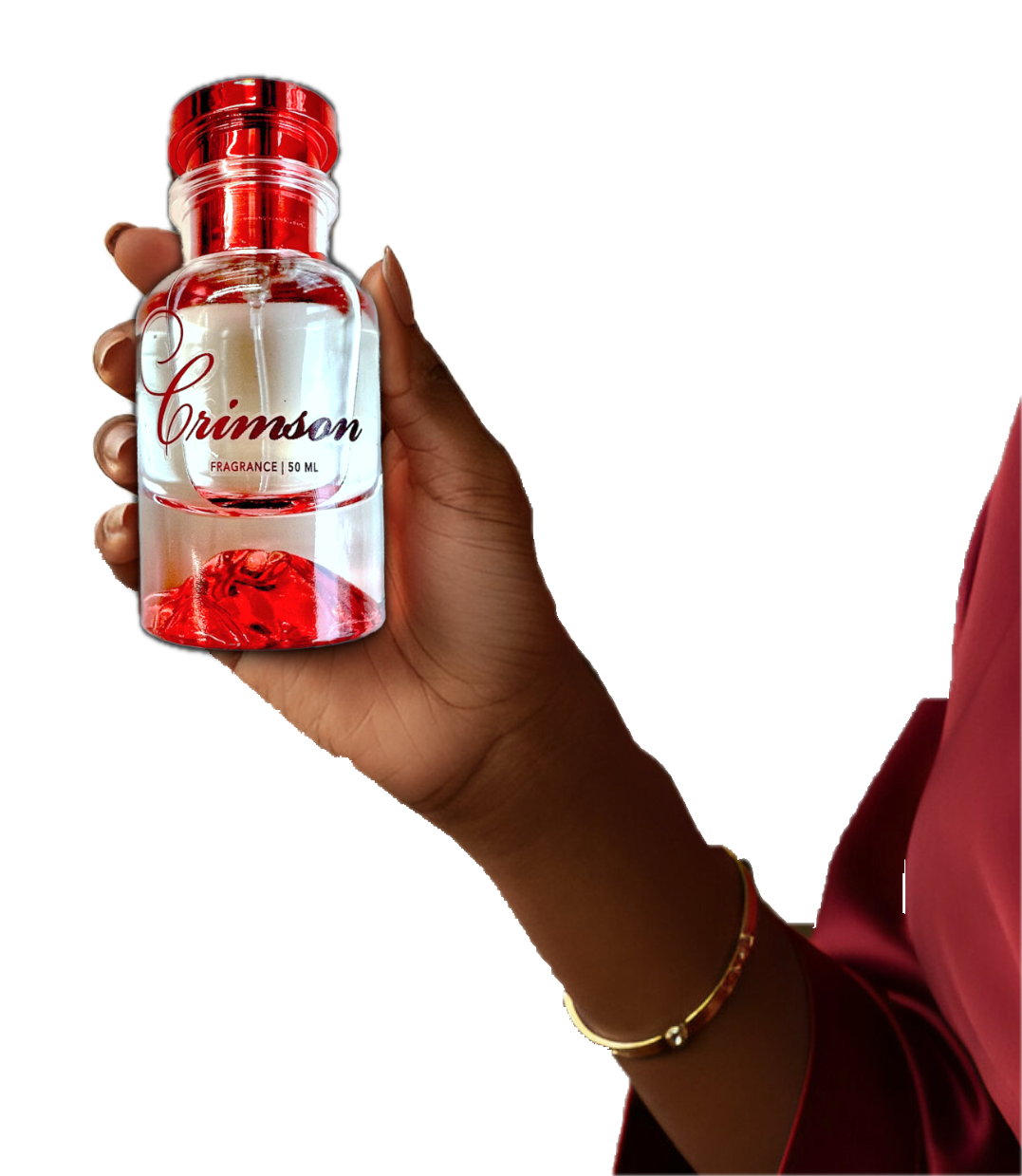 Hand holding a 'Crimson' perfume bottle with red cap and label.